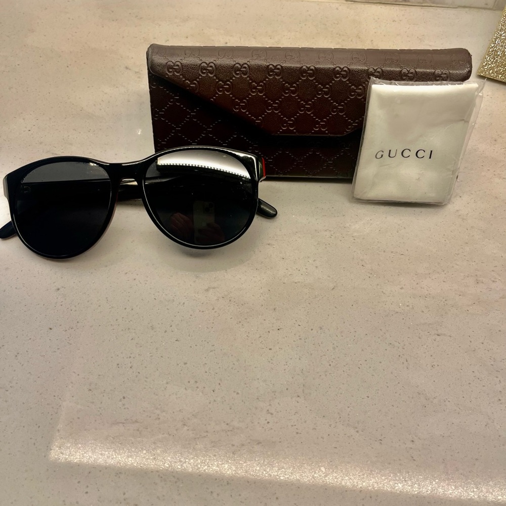 New Gucci sunglasses . Black with red/green piping.
